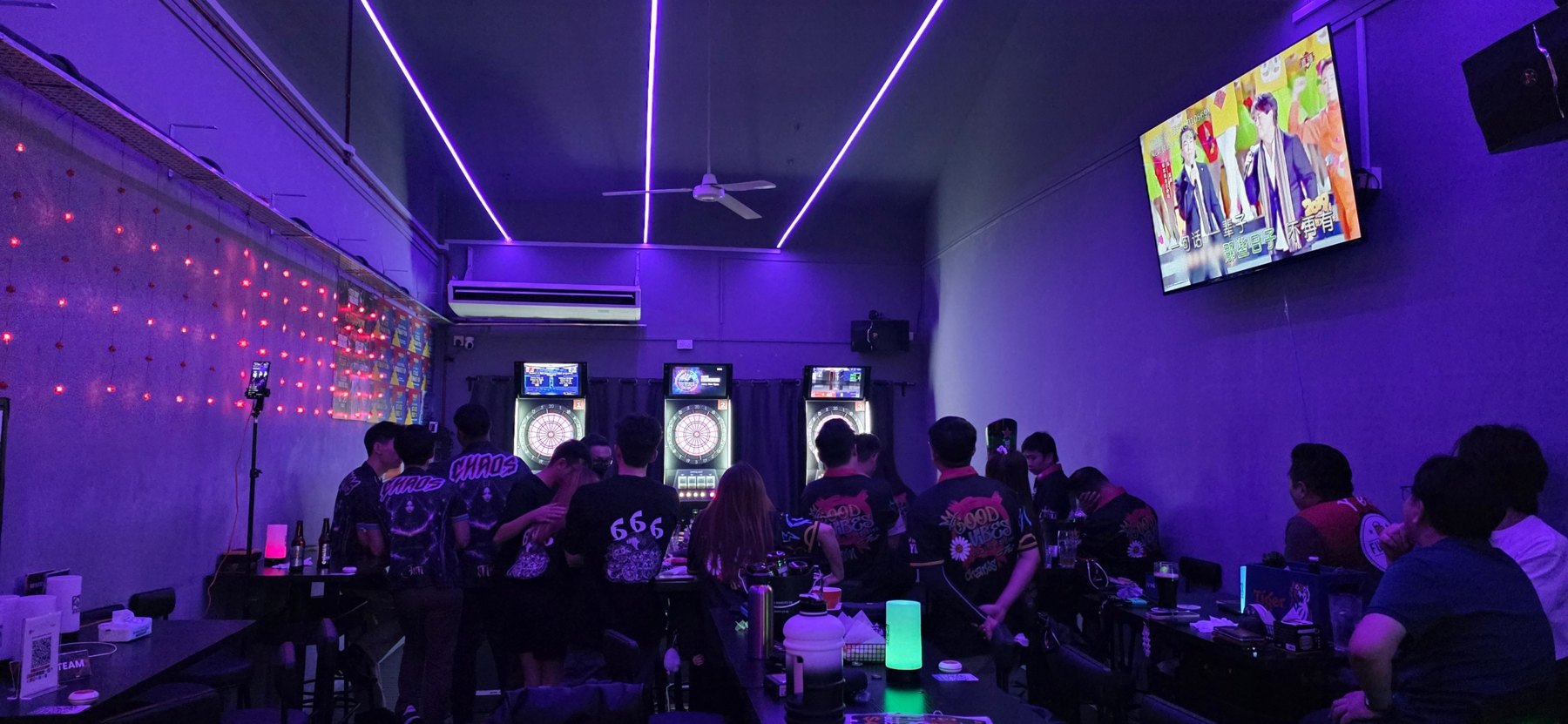 A lively crowd watching darts inside Good Vibes Social Club