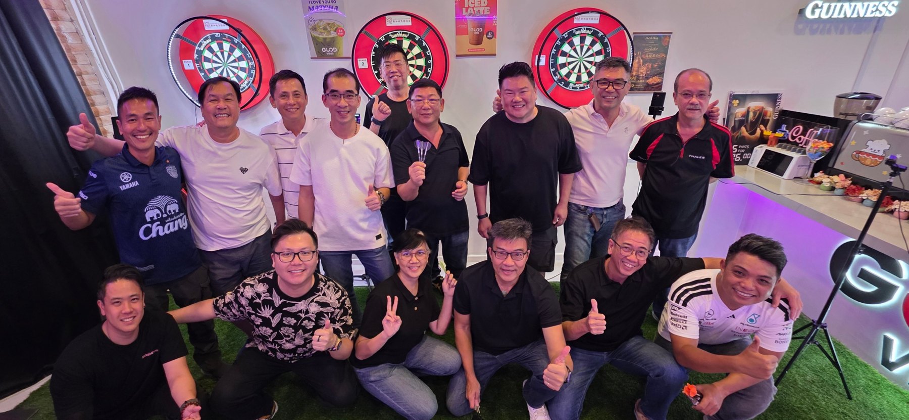 Friends celebrating a Friday Darts Night together